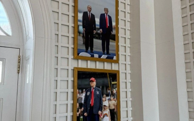 Putinlə çəkilmiş şəklini divardan asdı